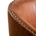 Poltrona Myles stile club commerciale con base girevole in metallo a 360° e rivestimento con borchie decorative